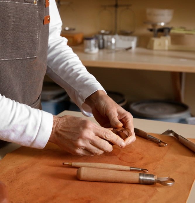 Artisans crafting custom leather jackets