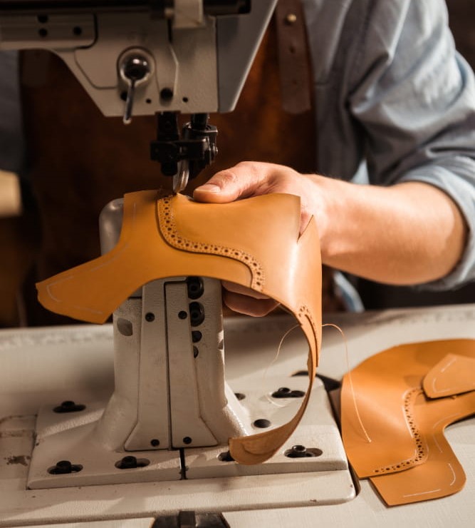 Master tailors working on premium leather