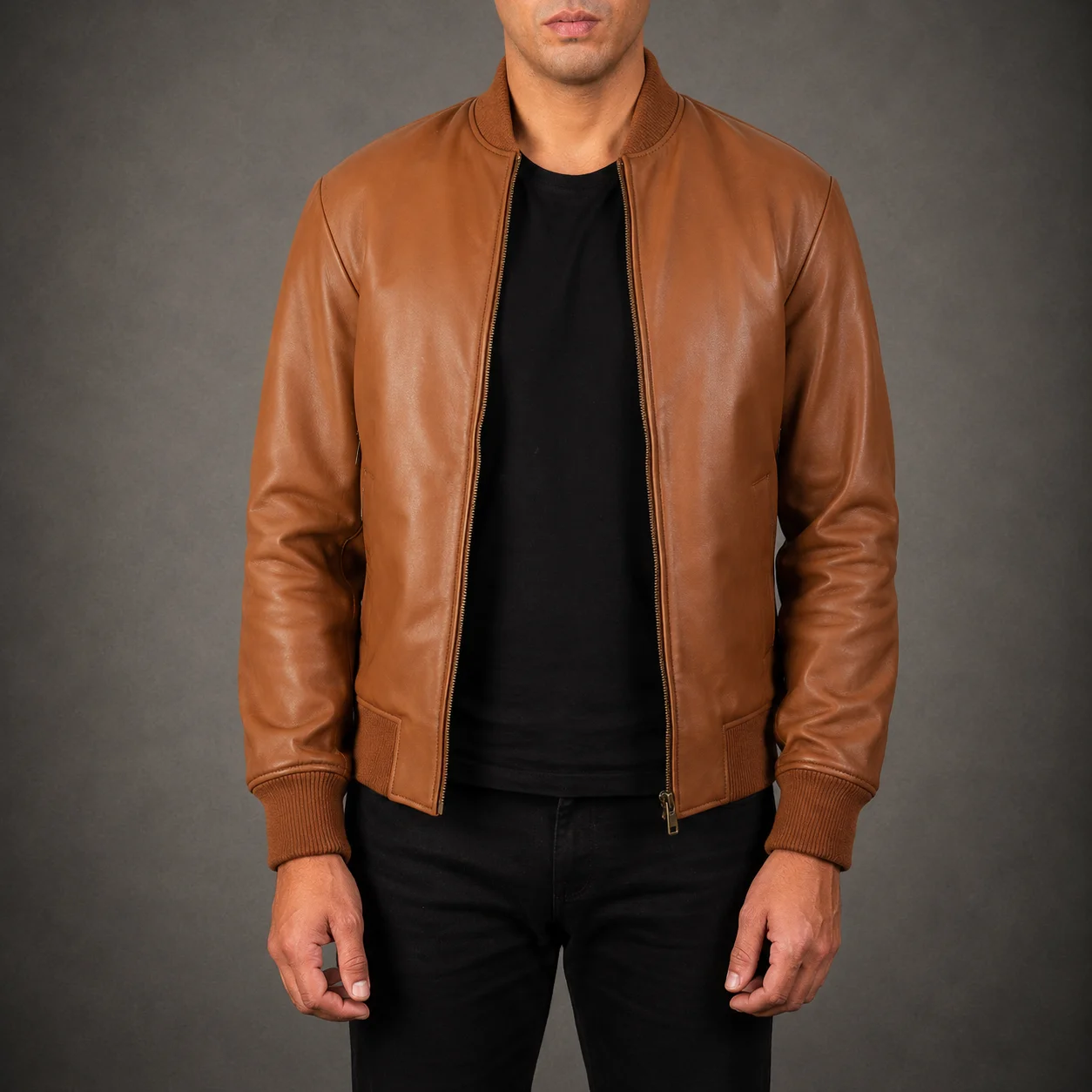 Men's Ashton brown leather bomber jacket crafted from premium genuine leather featuring a rich brown finish, classic bomber silhouette, ribbed cuffs and hem, durable construction, and timeless everyday style by Jonny N Guys