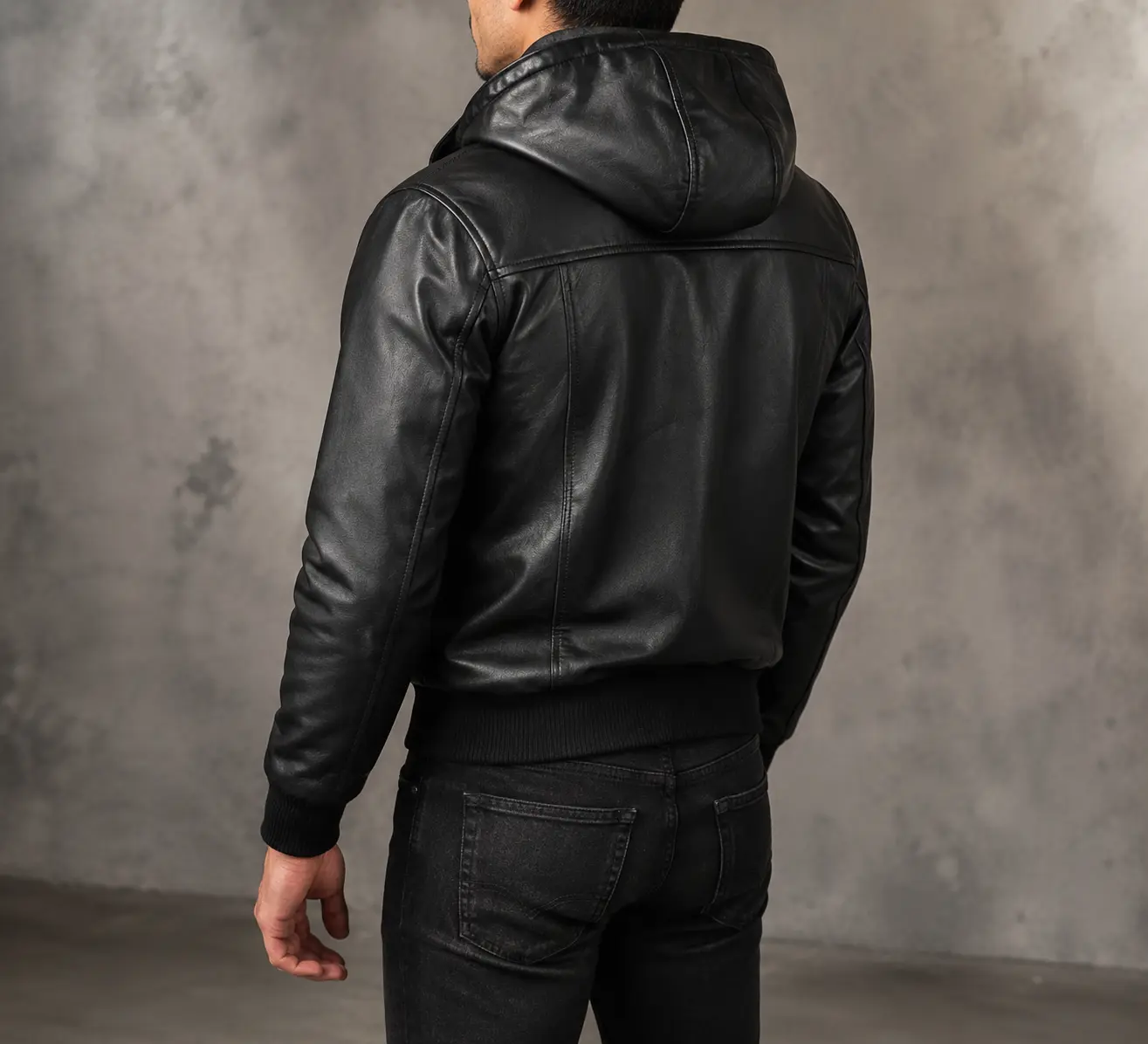 Axton Black Hooded Leather Bomber Jacket for men by Jonny N Guys, handcrafted from premium genuine sheepskin leather with an attached hood, rib-knit cuffs, YKK zipper, and soft fleece lining.